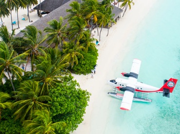 Airplane parked on a beautiful beach